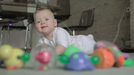 Adorable-baby-girl-playing-on-the-carpet