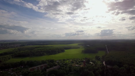 Flying-over-township-in-green-woods-Rural-landscape-in-Russia