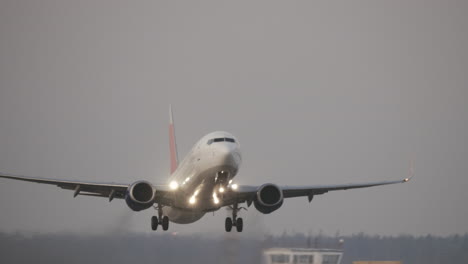 Jet-plane-departure-on-a-snowy-runway