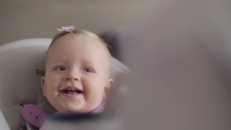 Baby-girl-laughing-when-eating