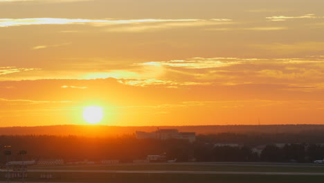 Plane-taking-off-at-sunset