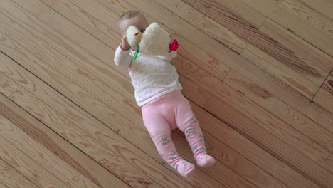 Baby-girl-playing-on-the-floor