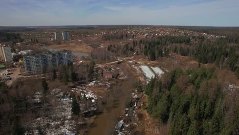 An-aerial-view-of-a-residential-wooded-area-on-a-bright-day