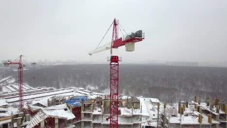 A-working-construction-crane-above-the-building-construction-area