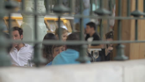 Young-people-relaxing-in-outdoor-cafe