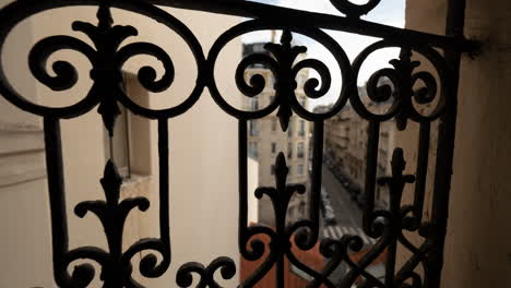 Timelapse-street-viewed-through-wrought-railing-Paris-France