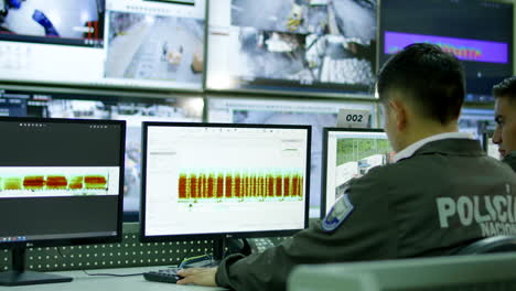 general-shot-of-male-security-guard-in-surveillance-room