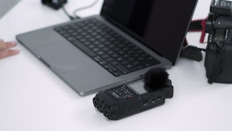 Multimedia-Expert-Adjusting-Digital-Audio-Interface-on-Desk