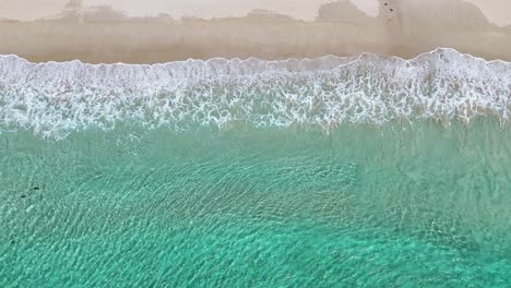 Drone-view-from-above-waves-breaking-on-Western-Australia-surf-beach