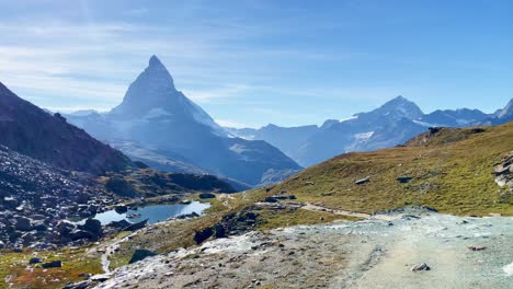 Mountain-Freedom:-Matterhorn-Mountain-Landscape-Near-Rotenboden-and-Gornergart,-Switzerland,-Europe-|-Walk-Along-Cliff-Overlooking-Scenic-Lake