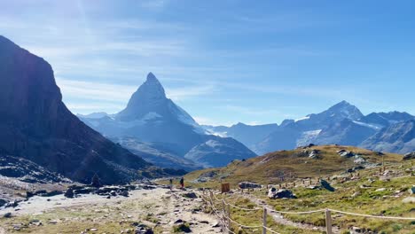Mountain-Freedom:-Matterhorn-Mountain-Landscape-Near-Rotenboden-and-Gornergart,-Switzerland,-Europe-|-Moving-Near-Remote-Rope-Fence-and-Travel-Couple,-Hiking
