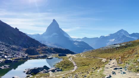 Mountain-Freedom:-Matterhorn-Mountain-Landscape-Near-Rotenboden-and-Gornergart,-Switzerland,-Europe-|-Shaky-Distant-View-of-YouTube-Influencer-Travel-Vlogging
