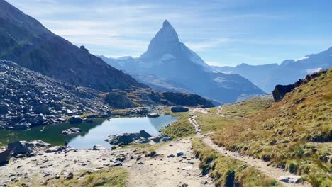 Mountain-Freedom:-Matterhorn-Mountain-Landscape-Near-Rotenboden-and-Gornergart,-Switzerland,-Europe-|-Distant-Walking-View-of-YouTube-Influencer-Travel-Vlogging