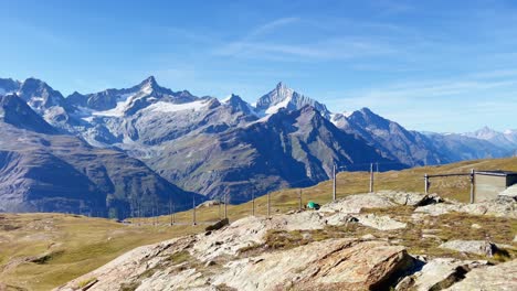 Mountain-Freedom:-Matterhorn-Mountain-Landscape-Near-Rotenboden-and-Gornergart,-Switzerland,-Europe-|-Moving-Towards-A-Scenic-Cliff-Overlooking-Train-Railway,-Hiking