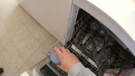 Point-of-view-of-man-filling-up-a-dishwasher