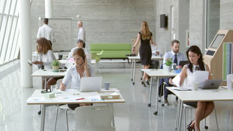 Businesspeople-Working-At-Desks-In-Modern-Office-Shot-On-R3D