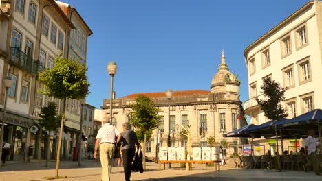 Tourists-walking-in-square-in-old-town,-Braga,-Portugal