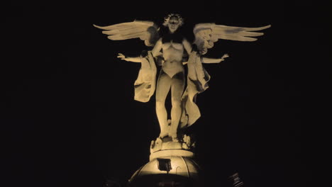 Winged-Victory-statue-on-the-top-of-Metropolis-Building-at-night-Madrid