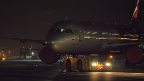 Towing-Aeroflot-aircraft-at-night