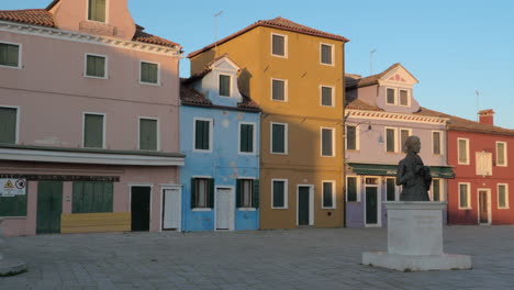 Child-playing-with-ball-at-Baldassarre-Galuppi-Square-in-Burano-Italy