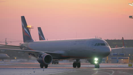 Parked-and-taxiing-planes-at-Sheremetyevo-Airport-in-Moscow-Evening-winter-view