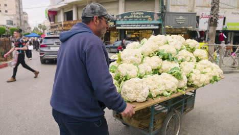 Old-Man-Selling-Cauliflowers-On-Cart-In-The-Street-Of-Hebron,-Palestine