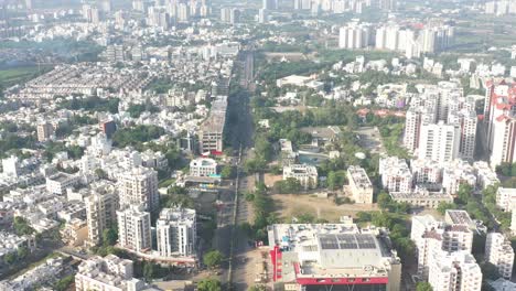 Rajkot-city-aerial-view-The-camera-is-going-past-the-treatment-plant-and-there-are-big-buildings-around