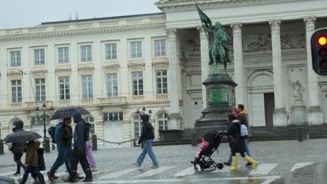 People-walking-past-the-Godfrey-of-Bouillon-Statue,-Brussels