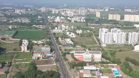 Rajkot-city-aerial-view-Talkies,-hotels,-petrol-pumps,-temples,-houses-are-visible-around-the-drone-camera