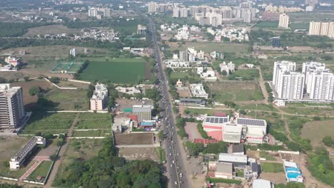 Rajkot-city-aerial-view-Drone-camera-is-moving-forward-and-traffic-is-visible-in-Saraja-hotel