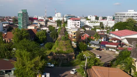 Aerial-Flying-Towards-That-Dam-On-Roundabout-In-Vientiane,-Laos-On-Sunny-Day