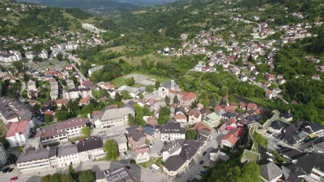 Beautiful-balkan-city-Jajce-in-Bosnia-and-Herzegovina,-aerial-orbit-skyline