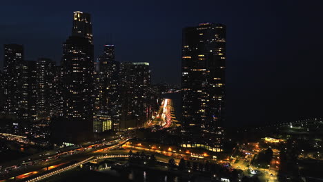 Aerial-view-toward-traffic-on-the-Lake-Shore-drive,-night-on-the-lakefront-of-Chicago