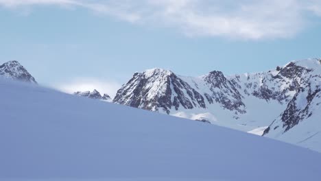 Snow-mountain-range-summit-on-sunny-winter-day