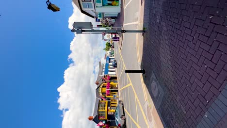 Sunny-Urban-Stroll:-Vertical-Video-of-Blanchardstown-Town-Centre-with-Pedestrians-and-Cars-on-a-Beautiful-Day