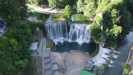 Beautiful-waterfall-Pliva,-in-Jajce,-Bosnia-and-Herzegovina,-aerial-orbit