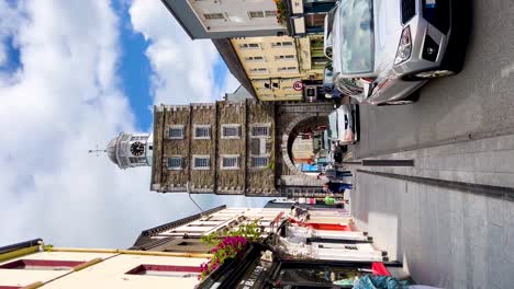 Sunny-Day-in-Youghal:-Vertical-Video-of-the-Historic-Clock-Gate-Tower-with-Busy-Streets-and-Local-Life-in-County-Cork