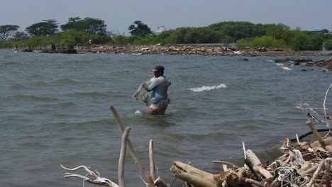 Fishing-activities-on-Baruna-beach,-Semarang,-Central-Java,-Indonesia