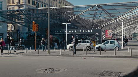 Pedestrians-at-Galleria-Garibaldi-Entrance,-Naples,-Italy