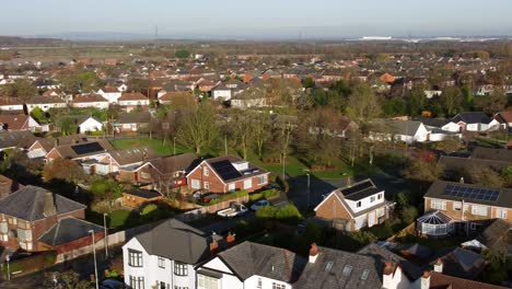 Aerial-view-expensive-British-middle-class-property-in-sunny-rural-suburban-neighbourhood