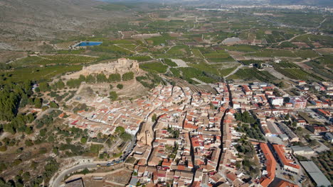 Aerial-view-of-the-town-of-Montesa-and-the-ruins-of-its-castle-at-the-top-of-the-hill