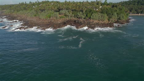 Establishing-Aerial-Drone-Shot-Heading-Towards-Tropical-Rocky-Coastline-in-Southern-Sri-Lanka