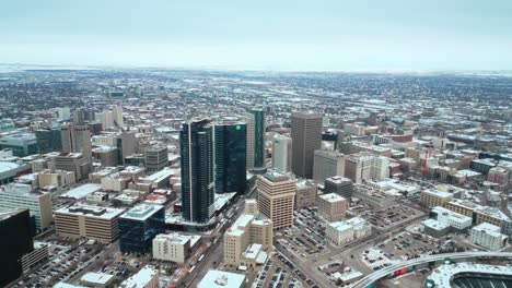 A-4K-Establishing-Cinematic-Drone-Out-Shot-of-Downtown-Treaty-One-Land-Skyscrapers-Buildings-Arena-Shaw-Park-Baseball-Diamond-Urban-Landscape-Winter-in-Capital-City-Winnipeg-Manitoba-Canada-Aerial