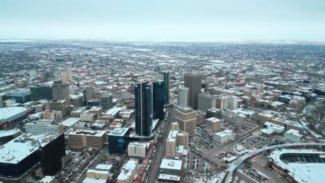 LONG-4K-Establishing-Cinematic-Slow-Orbit-Drone-Shot-of-Downtown-Treaty-One-Land-Skyscrapers-Buildings-Arena-Shaw-Park-Baseball-Diamond-Urban-Landscape-Winter-in-Capital-City-Winnipeg-Manitoba-Canada