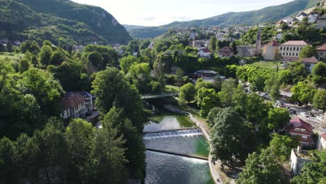 Jajce-Riverside-View-with-Cascading-Falls,-Bosnia