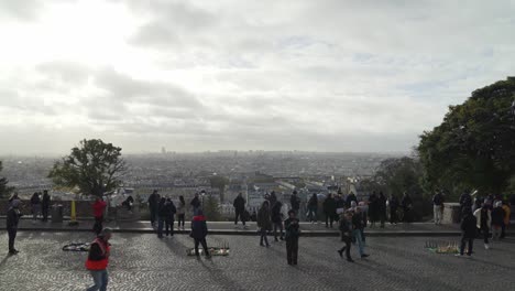 Sellers-Sells-Toy-Eiffel-Tower-near-Panoramic-Overlook-of-Paris-near-Square-Louise-Michel