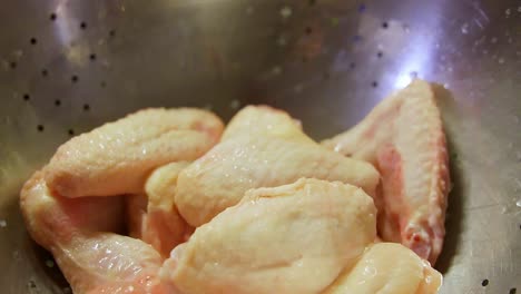 Uncooked-chicken-wings-in-aluminium-bowl-ready-to-be-prepared