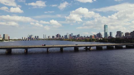 Boston-City-Skyline,-People-And-Cars-Travelling-On-Harvard-Bridge