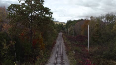 Railroad-Track-On-Androscoggin-River-During-Fall-Season-In-New-Hampshire,-New-England