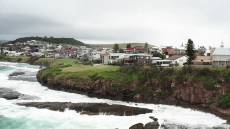 Aerial-drone-shot-of-real-estate-in-Gerroa-on-a-stormy-day-in-the-south-coast-of-New-South-Wales,-Australia
